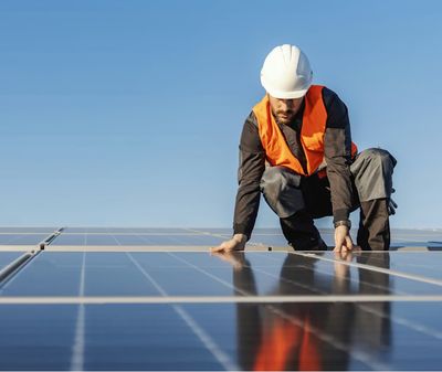 Young adult male learning how to install and maintain solar panels